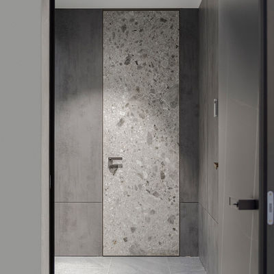 Puertas interiores con marco de aluminio negro insonorizado y acabado de piedra